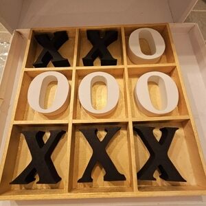 Gold wooden board game X O also used for decorative purposes